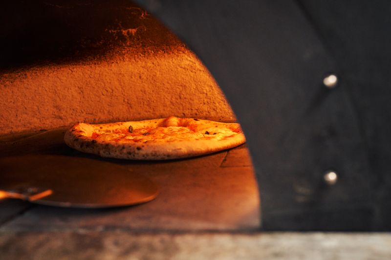 Handcrafted punch pizza fresh out of the oven